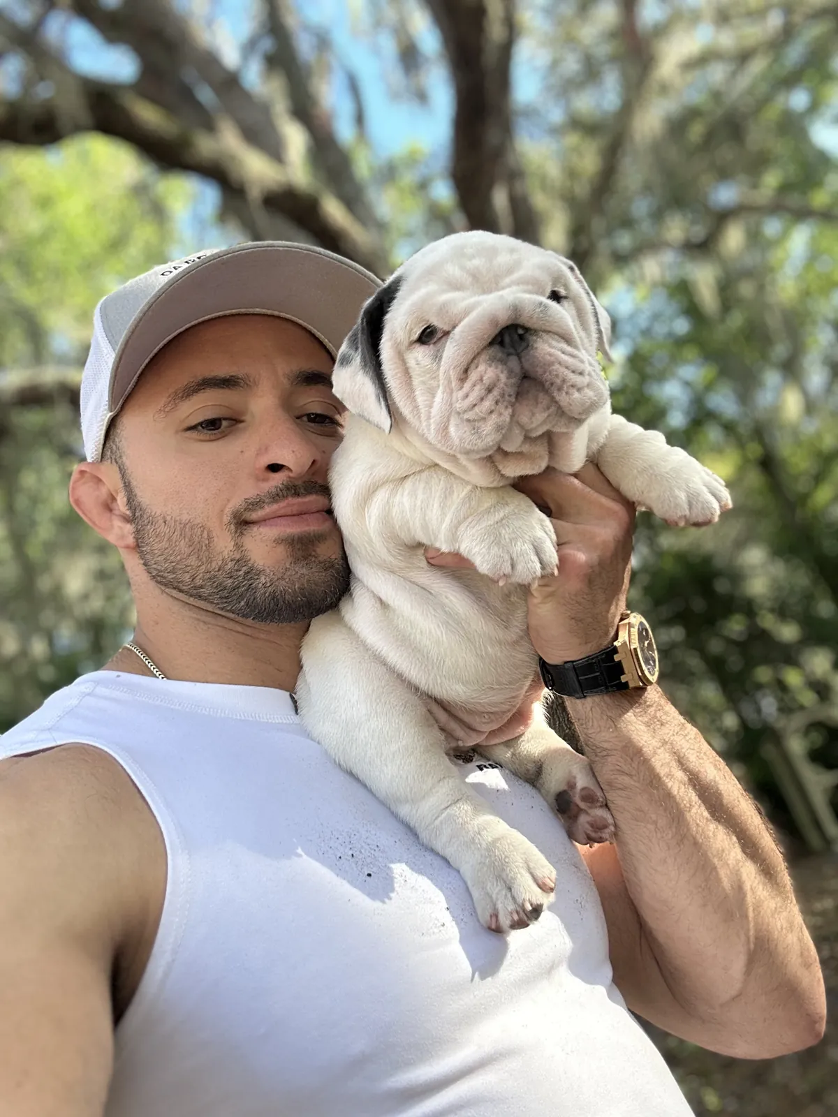 Jason soares holding cream bulldog puppy
