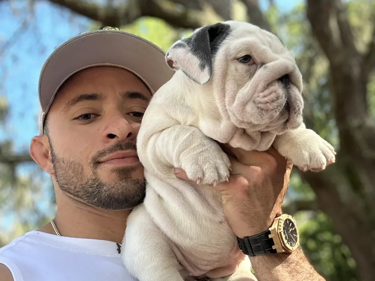 Jason soares with white english bulldog puppy